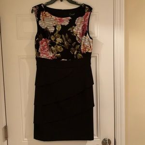 Beautiful black bottom dress with floral top.  Size 12 and never been worn.